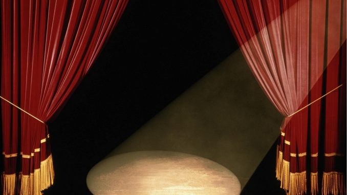 Theatre stage with red curtains